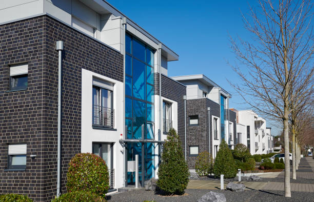 istock Row of modern town houses and trees 1383862921