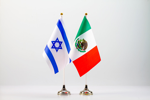 State flags of Israel and Mexico on a light background.