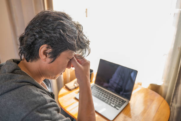 istock A man in remote work massaging tired eyes 1383866381
