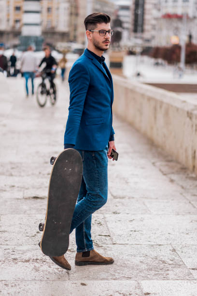 istock Handsome businessman in a summer city 1383868497