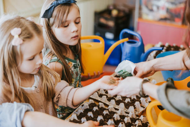 istock Children sowing seeds at classroom 1383869027