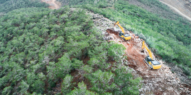istock Two excavators on earthworks aerial view 1383871008