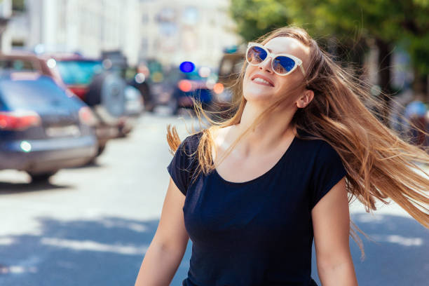 istock Pretty Young Woman Posing On Camera In Summer Day 1383871587