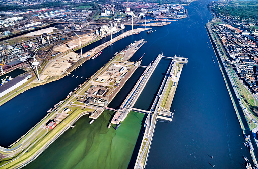 Netherlands, IJmuiden - 20-02-2022: Aerial view of the largest sluice (lock) in the world. For the largest boats and ships a new sea lock in the Noordzeekanaal.