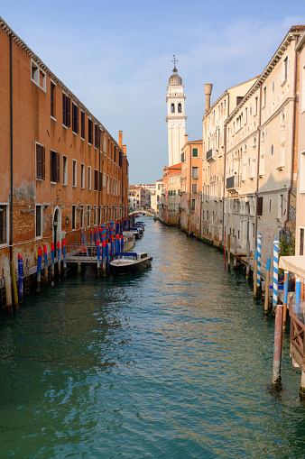 Looking up the Rio Dei Greci towards the iconic leaning tower of Venice, also known as the Campanile of Santo Stefano.