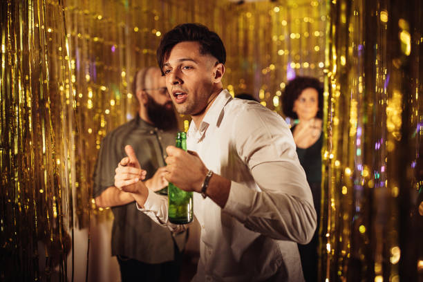 istock Handsome man at the party 1383881060