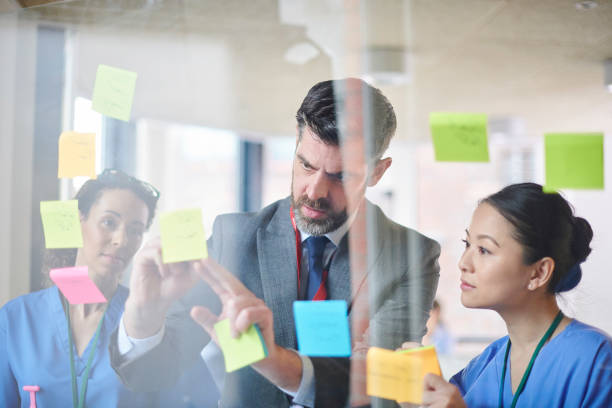 istock sales presentation to medical team 1383881148