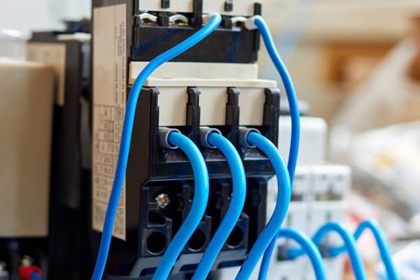 istock blue wires connected to the magnetic starter relay 1383885702