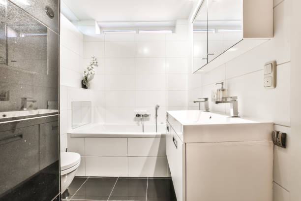 istock Bathroom interior with bathtub and double sink 1383886649