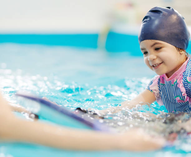 istock Baby girl learning to float 1383887761