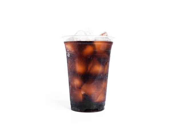 istock Soda with ice in a transparent plastic glass isolated on a white background 1383891124