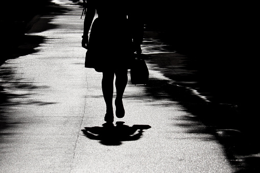 Female legs on a sidewalk, concept of depression, quarantine in the city during coronavirus pandemic