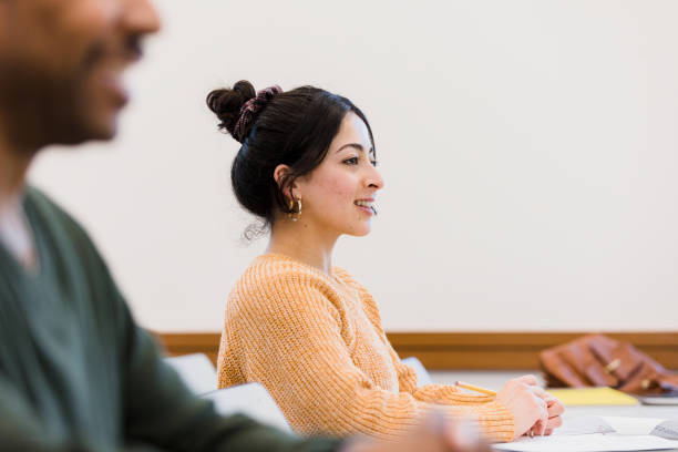 istock Proud young adult female student 1383898961