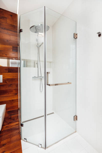 istock modern glass shower room with trim 1383908399