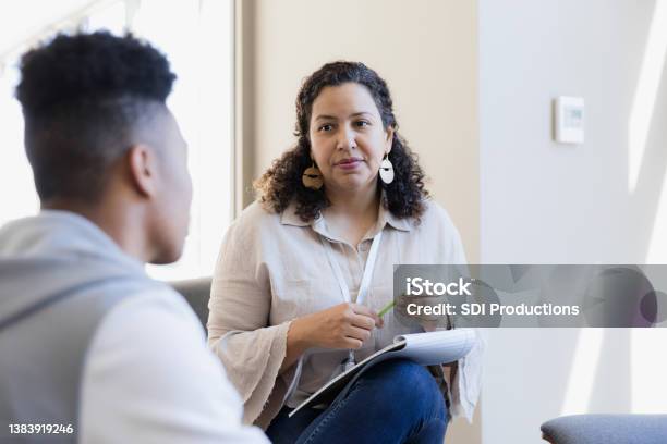 Counselor Listens Stock Photo - Download Image Now - Mental Health Professional, Psychotherapy, Mental Health