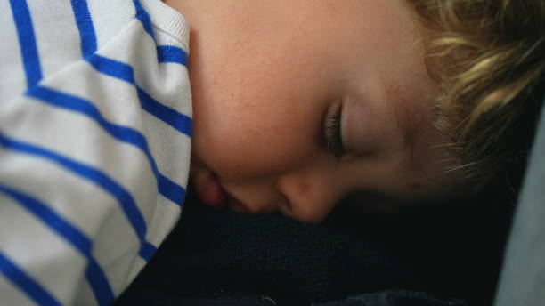 istock Child asleep close-up toddler boy face sleeping napping 1383919333