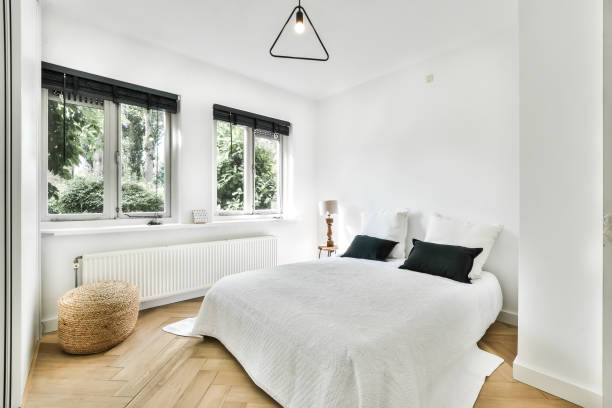istock Bedroom with a large bed in a modern house 1383933173