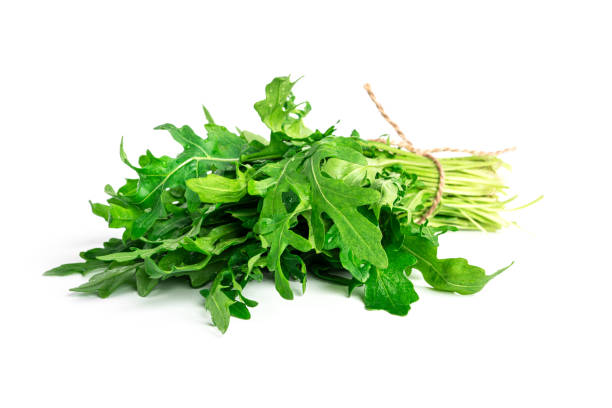 istock Arugula isolated on white background. A bunch of arugula 1383933836