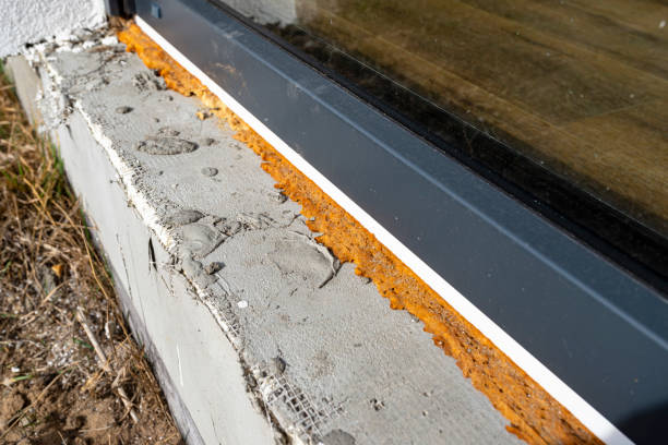 istock Old yellowed mounting foam under a large terrace window, visible styrofoam insulating the foundations of the house. 1383936629