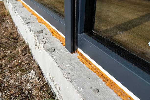 istock Old yellowed mounting foam under a large terrace window, visible styrofoam insulating the foundations of the house. 1383936641