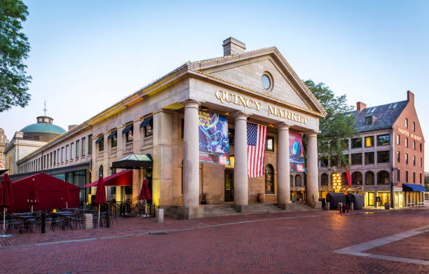 Boston, Massachusetts, USA -August 9, 2016: view of the historic architecture of the Quincy Market in Boston, Massachusetts, USA at Government Center where tons of tourists come to shopping and eat the typical food of Boston by the Faneuil Hall.