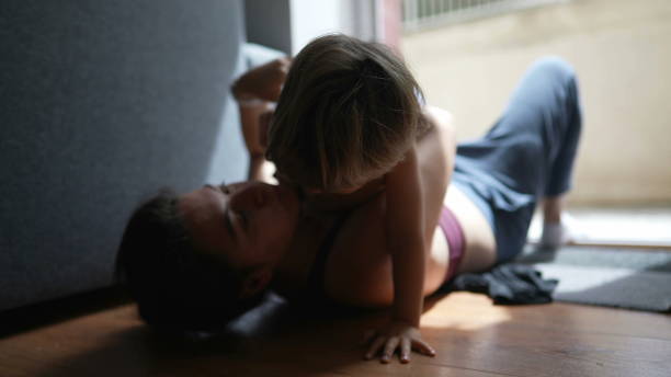 istock Mother and toddler bonding together candid mom and child playing 1383945607