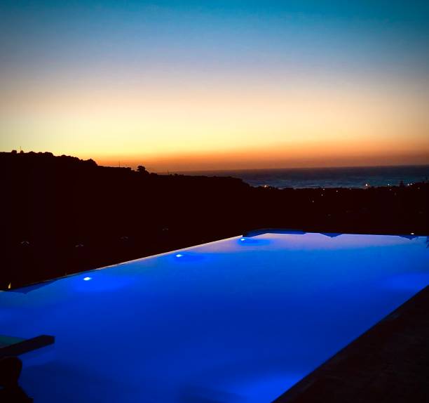 istock Sunset Reflections of a Swimming Pool 1383949994