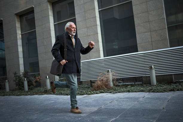 istock Senior businessman on the run 1383950192