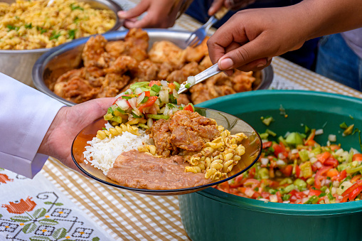 Simple and traditional Brazilian food being served in a popular restaurant for the local low-income population.
