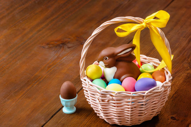 istock Easter composition with chocolate eggs and a bunny in the basket 1383952539