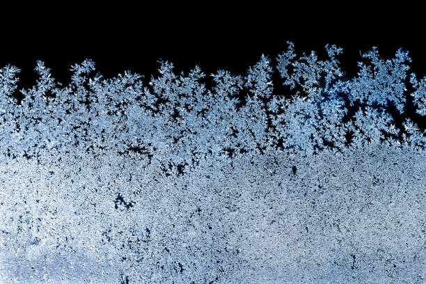 istock Rime texture on the frozen window in cold winter morning. Background pattern. 1383952724