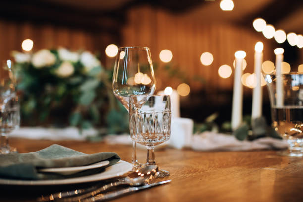 istock Empty wine glasses on a wooden table. Table decoration for a festive dinner 1383953026
