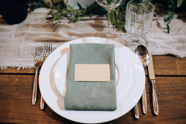 istock Beautiful table setting on a wooden table in restaurant 1383953035