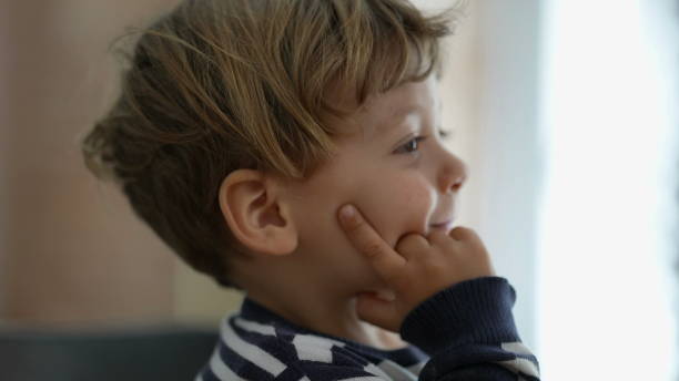 istock One pensive little boy thoughtful child portrait face 1383955952