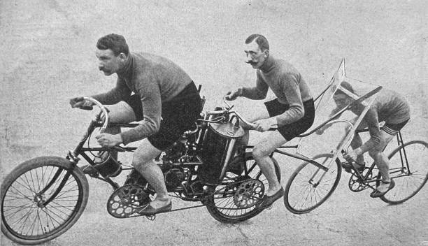 istock Two cyclists in the slipstream of a motorcycle 1383957901