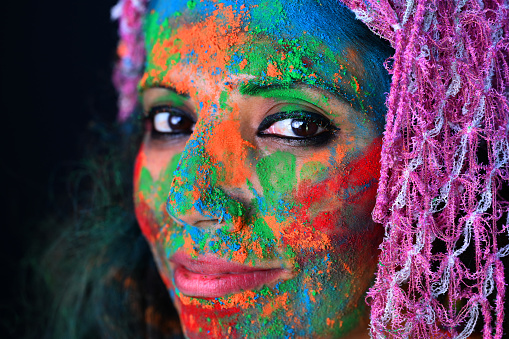 A young girl celebrating the festival of colours, Holi.