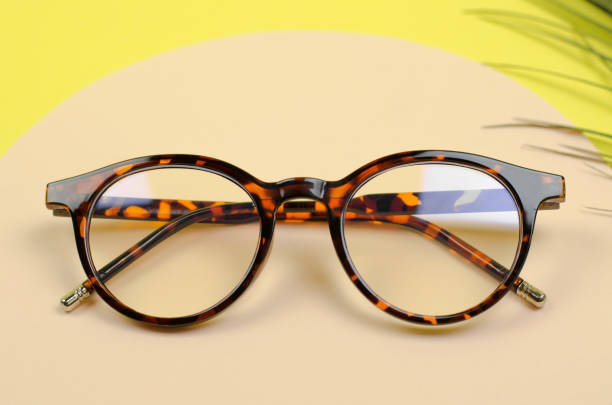 istock Stylish women's glasses on a colored background. Leopard glasses 1383961334