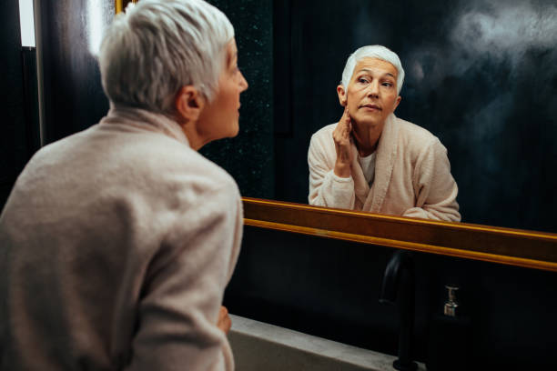 istock Senior woman doing her morning routine in bathroom 1383964077