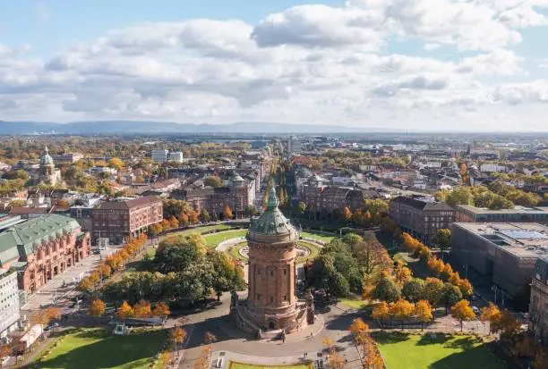 Autumn aerial cityscape of Mannheim city, Baden-Württemberg, Germany. Friedrichsplatz with the Mannheim Water Tower (Wasserturm) in the foreground