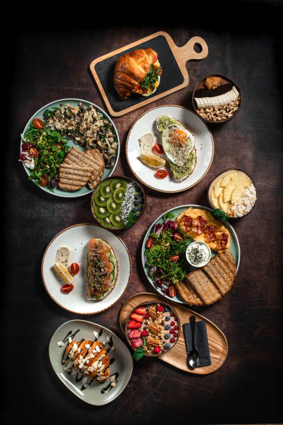 istock Directly above view of breakfast with coffee on wooden table 1383967784