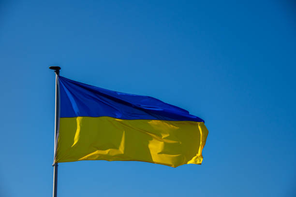 istock A Ukraine flag against a cloudless sky 1383969406