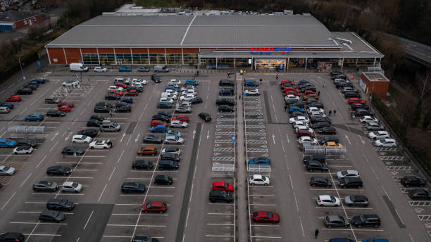 Wigan, UK: March 10, 2022: Aerial image over the Tesco Extra store and car park at the retail park stock photo