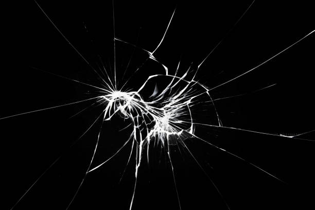 istock Cracks on the smartphone screen, break the glass on the phone. Effect for design on a black background. 1383970834