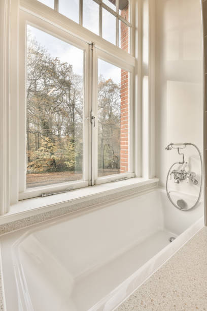 istock Bathroom with a bathtub near the window 1383974227