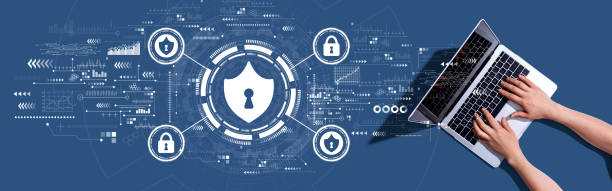istock Cyber security theme with woman using a laptop 1383977492