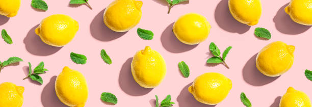 istock Fresh yellow lemons with mints overhead view 1383977527