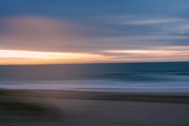 istock Sea during a colorful sunset with a motion effect - a cool picture for wallpapers and backgrounds 1383979757