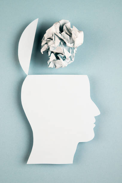 istock Human head in paper cut style with crumpled paper 1383985418
