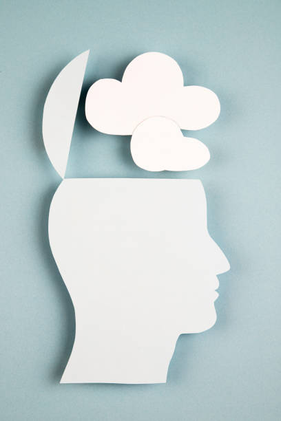 istock Human head in paper cut style with clouds 1383985504