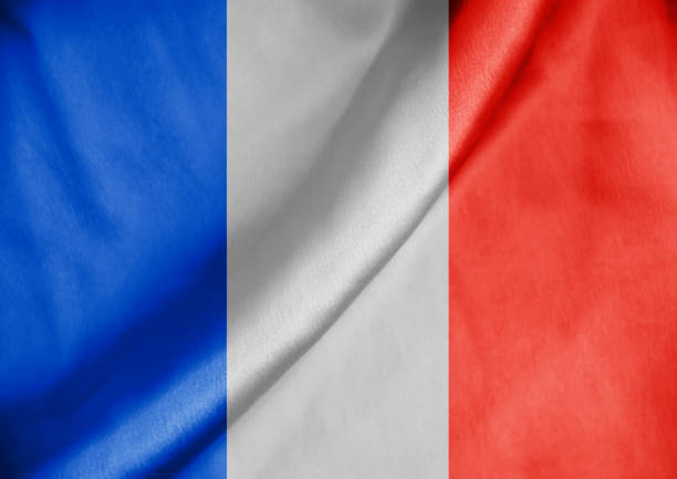 istock France flag, silk fabric background 1383985875